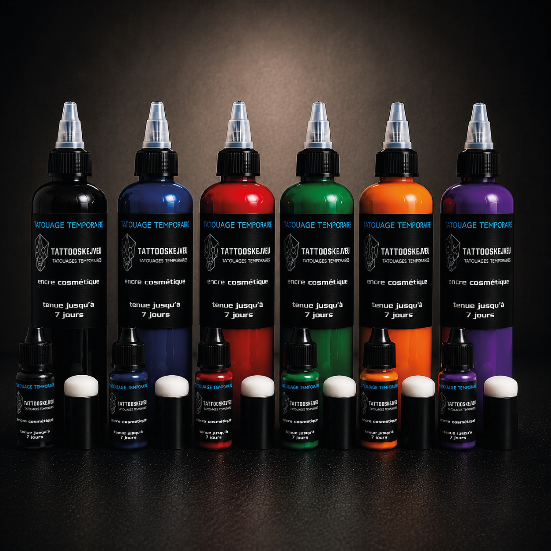 Collection d’encres à séchage rapide pour tatouage temporaire en noir, bleu, rouge, vert, orange et violet, disponibles en flacons de 10 ml et 100 ml.